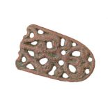 An incomplete cast Late Anglo-Saxon (c. 900-1000) copper-alloy openwork strap end of Thomas’ (2000)