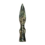 A complete cast copper-alloy socketed and looped spearhead belonging to the 'developed side loop'