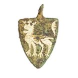A complete cast copper-alloy and enamel heraldic harness pendant dating to the Medieval period, c.