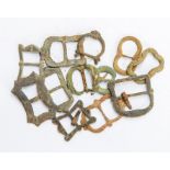 Twelve copper-alloy buckles, most double-looped examples from the 16th and 17th centuries. Three