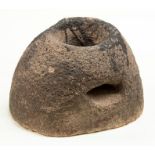 The upper stone component from a late Iron Age 'beehive' type quern probably dating c. 200 BC-AD