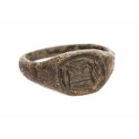 A complete cast copper-alloy finger ring dating to the Late Medieval period, c. 1400-1500. The ring