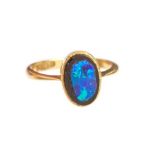 An 18ct gold ring, set with a slice of black opal, size J, approx 2.5gms, Birmingham 1919