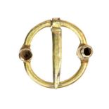 A virtually complete gold annular brooch dating to the Medieval period, c. 1200-1400. The brooch