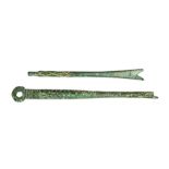 Two cast copper-alloy cosmetic implements dating to the Roman period, c. AD 43-410. Both probably