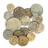 A group of sixteen cast lead-alloy tokens, dating c. 1500-1800. Various designs, most cross-