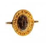 A complete gold seal ring with a possibly semi-precious intaglio setting dating to the Medieval