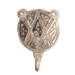 A complete silver hooked tag or clothing fastener dating to the Middle Saxon period, c. 750-900. The