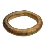 A complete cast copper-alloy bracelet or arm-ring of the so-called 'Liss type', dating to the Middle