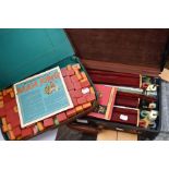 Two mid 20th Century Mahjong games, one in zip leather case, the other in briefcase style case