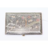 A white metal Indian cigarette case, with etched decoration and coloured enamel details, depicting