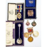 A  silver Masonic medal in original box along with a Masonic coin Duke of Sussex, two medallion