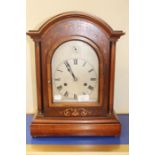 A mantle clock with hourly strike, mahogany case