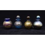 Four Isle of Wight goid lustre perfume bottles (one missing stopper)