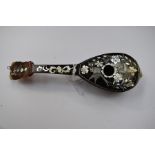 Faux tortoiseshell guitar piece with inlaid mother of pearl detail (a/f)