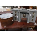 A Palladian style toy model of a County hall and Greenish and Dawkins dress makers and tailoring hat