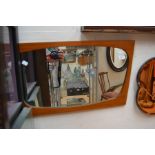 A 1950's teak framed mirror