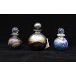 Three Isle of Wight glass goid lustre perfume bottles (all with stickers and stoppers)