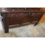 A  late 17th Century oak three panelled coffer with carved panel to front. c,1690,