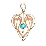 An Edwardian Art Nouveau style 9ct rose gold openwork ladies heart shaped pendant with sinuous swirl