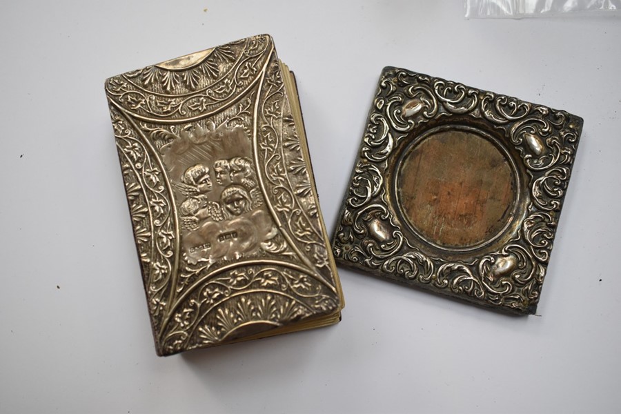 An Edwardian silver backed common prayer book, pocket size, the front cover depicting Reynolds