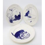 Four Poole Pottery blue and white cat plates, made for the National Trust inspired by examples