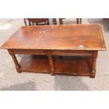 Rectangular large Oak coffee table with six supports and lower shelf.