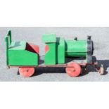 A 20th century green and black enamel painted wood and metal train, 85cm length.