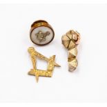 Masonic interest- A Masonic 9ct gold and silver folding ball pendant, size approx 14mm, a/f small