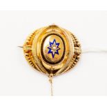 A Victorian brooch, blue enamel, detail set to the centre with seed pearl, unmarked yellow metal,