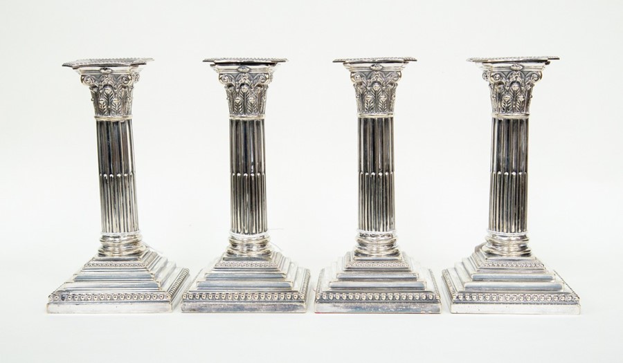 Two pairs of plate candlesticks, classical column form