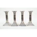 Two pairs of plate candlesticks, classical column form