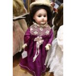 Armand Marseille bisque head doll, fully jointed composition body, open mouth with four teeth, 16"