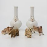 Assorted Continental ceramic pieces including a pair of vases with mask decoration, 12cms high