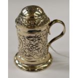 A Victorian silver kitchen pepper with embossed floral and Rococo style decoration, hallmarked for