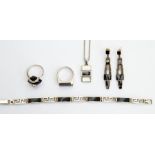 A collection of sIlver and onyx jewellery to include a bracelet with alternate rectangular links