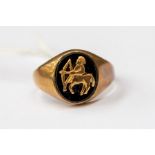 An onyx and 9ct gold signet ring, depicting Sagittarius 3.3 grams approx