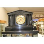 A German slate mantle clock, early 20th Century, complete with key