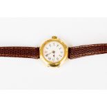 A ladies 18ct gold vintage watch, enamel round dial with numbers,  circa 1930's, on brown leather