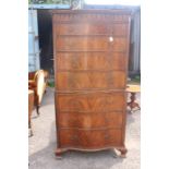 A George III style mahogany serpentine fronted chest on chest, the upper section with four long