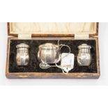 A cased silver cruet set, Birmingham 1933, E.F Braham Ltd, comprising salt, pepper, mustard with