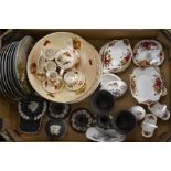 A collection of Royal Albert Country Rose black Jasper ware cabinet plates, and Royal Worcester