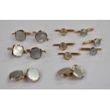 A Gents 14ct gold and mother-of-pearl cufflink and dress stud set, comprising a pair of cushion