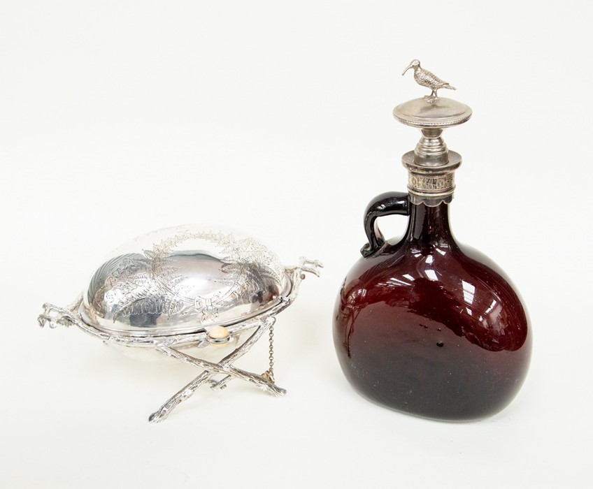 A 19th Century glass flask with a white kiwi finial and a Victorian plated revolving butter dish (