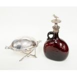 A 19th Century glass flask with a white kiwi finial and a Victorian plated revolving butter dish (