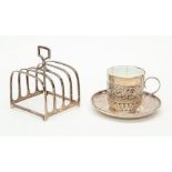 London silver cup and saucer with ceramic inner (cracked) and Birmingham silver toast rack