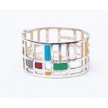 A silver enamel bangle, open work silver geometric design, Mondrian style, blue, green, yellow, red,