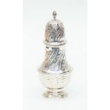 A silver sugar sifter, embossed decoration, London, total gross weight approx 147.6 grams