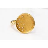 An 18ct gold and diamond ring, by Links of London, disc shaped form interspersed with small flush