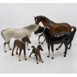 Five John Beswick horses; three bay, one black along with a grey dapple (AF broken leg)